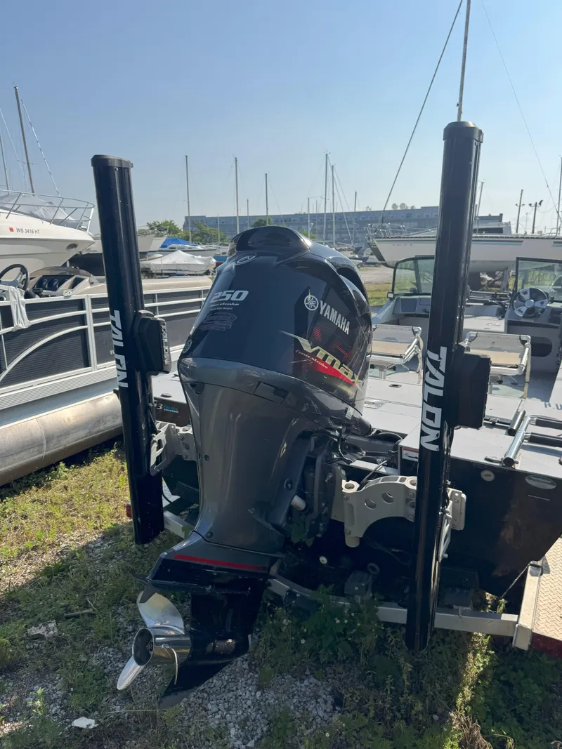 Slide: The Image of 2019 Sportsman 2400 G3 boat with Yamaha 250 engine and Talon anchors at marina. - 11