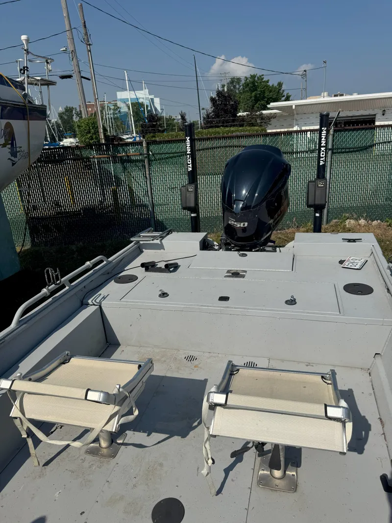 Slide: The Image of 2019 Sportsman 2400 G3 boat with dual seats and powerful outboard motor. - 2