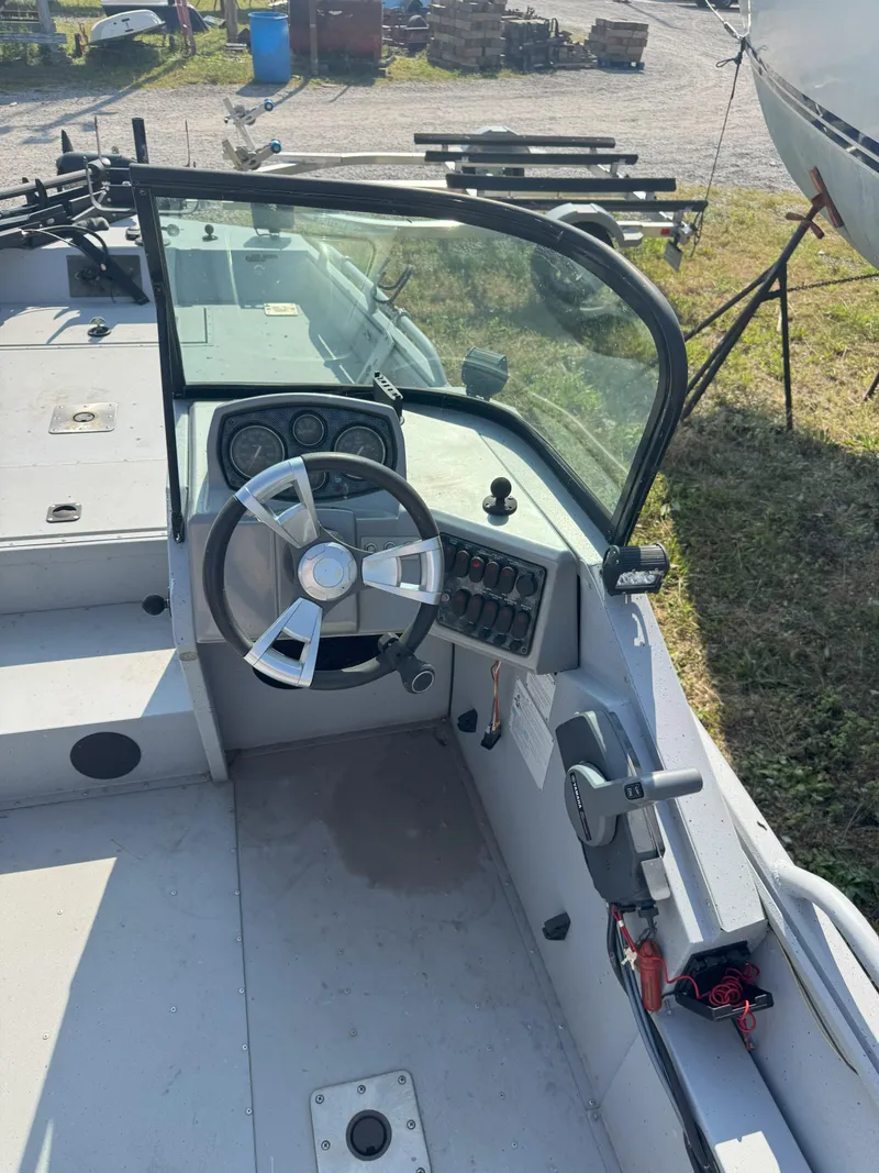 Slide: The Image of Steering console of a 2019 Sportsman 2400 G3 boat, featuring controls and gauges. - 4