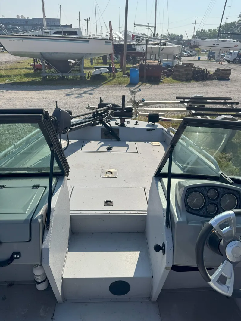 Slide: The Image of Interior view of a 2019 Sportsman 2400 G3 boat at a marina. - 7
