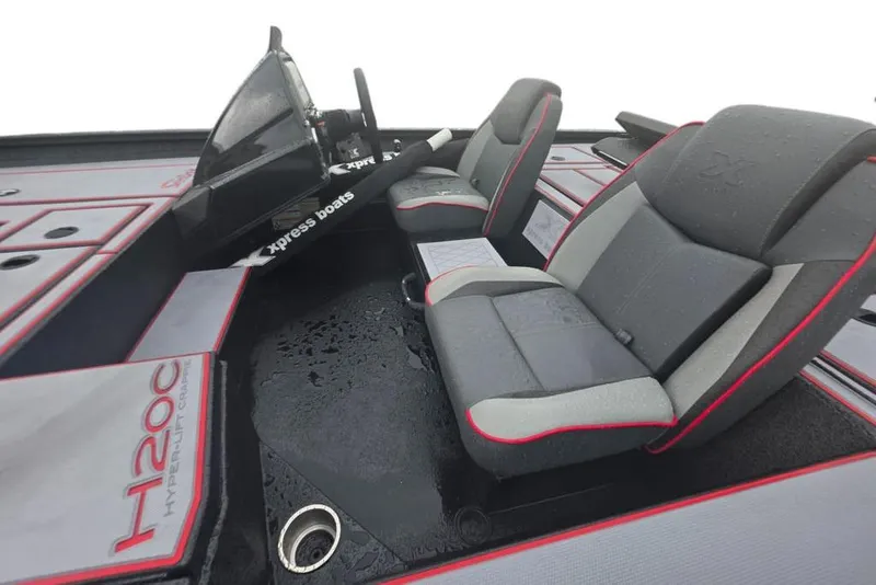 Slide: The Image of 2026 Xpress H20C Crappie Hyper-Lift Series boat interior with dual seats and steering console. - 11