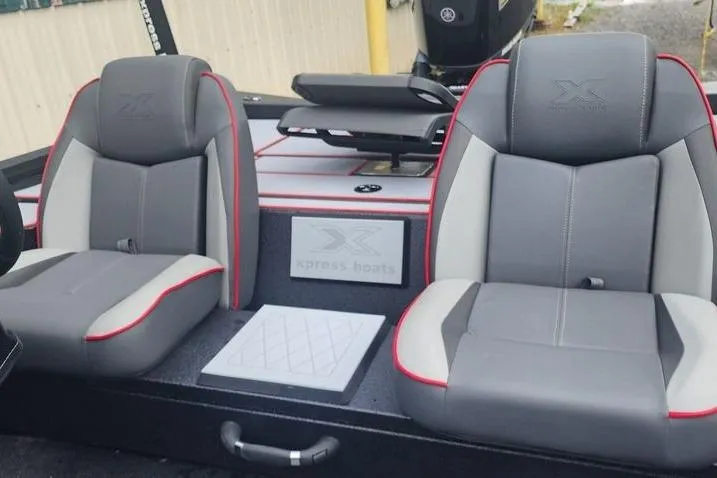 Slide: The Image of 2026 Xpress H20C Crappie Hyper-Lift Series boat seats with gray and red accents. - 12