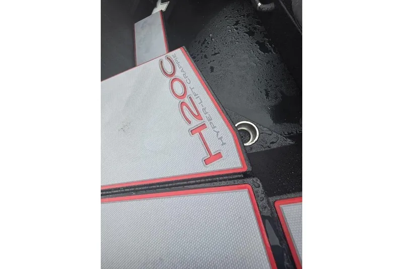 Slide: The Image of 2026 Xpress H20C Crappie Hyper-Lift Series boat deck with water drainage. - 13