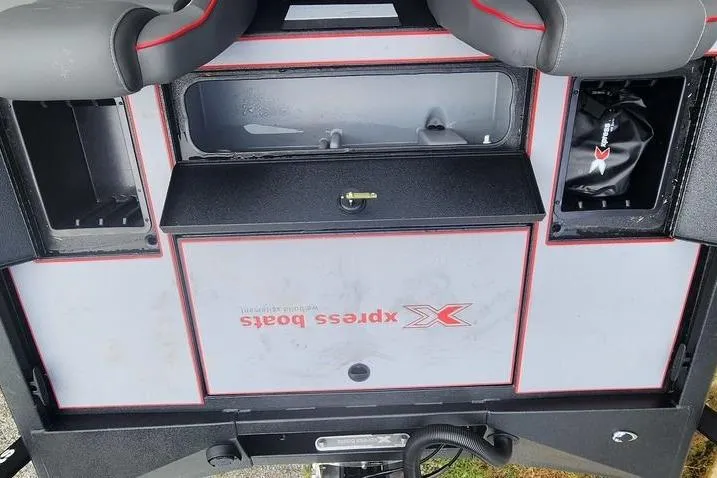 Slide: The Image of 2026 Xpress H20C Crappie Hyper-Lift Series boat interior with storage compartments. - 16