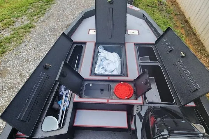 Slide: The Image of 2026 Xpress H20C Crappie Hyper-Lift Series boat with open storage compartments. - 22