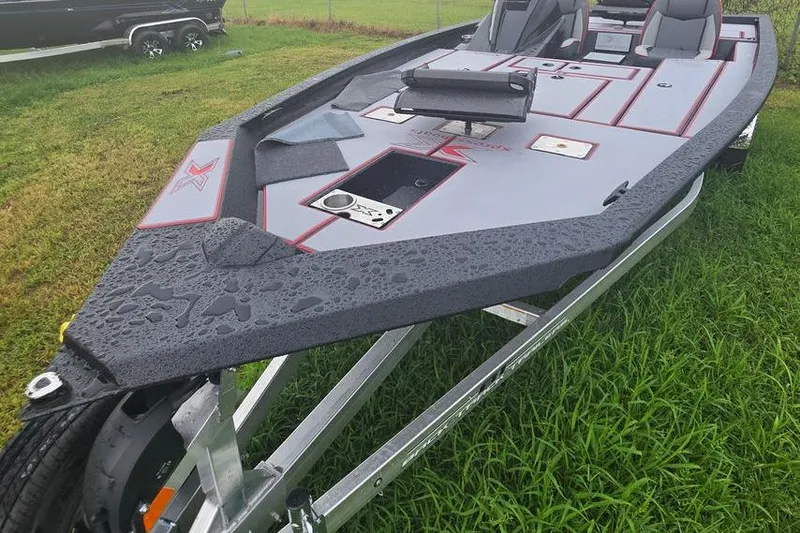 Slide: The Image of 2026 Xpress H20C Crappie Hyper-Lift Series boat on trailer, wet from rain. - 3