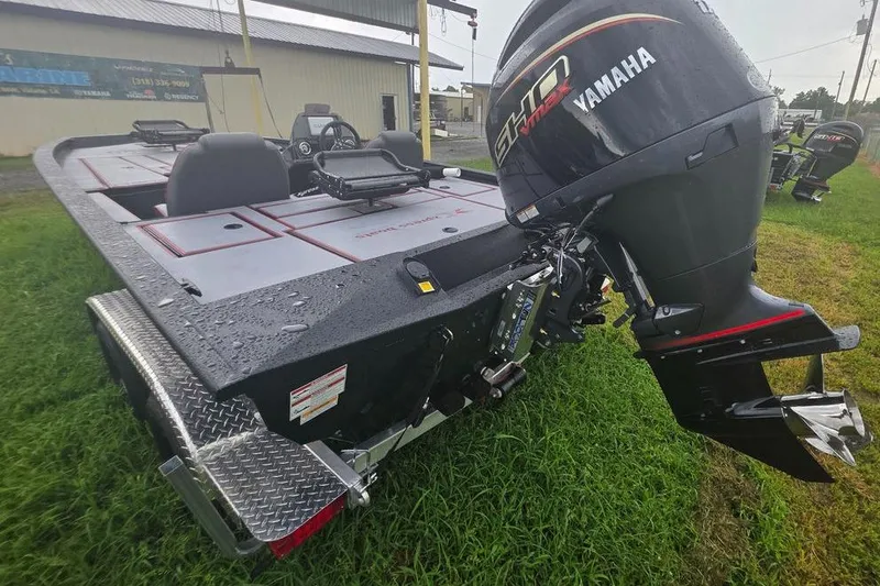 Slide: The Image of 2026 Xpress H20C Crappie Hyper-Lift Series boat with Yamaha engine on grass. - 8