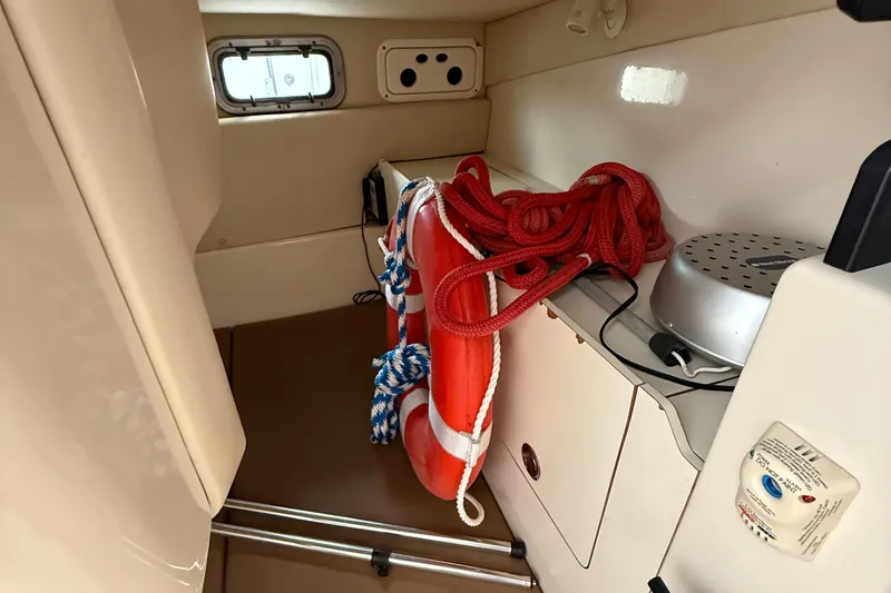 Slide: The Image of Interior of 2006 Boston Whaler 285 Conquest with life preserver and red rope. - 17