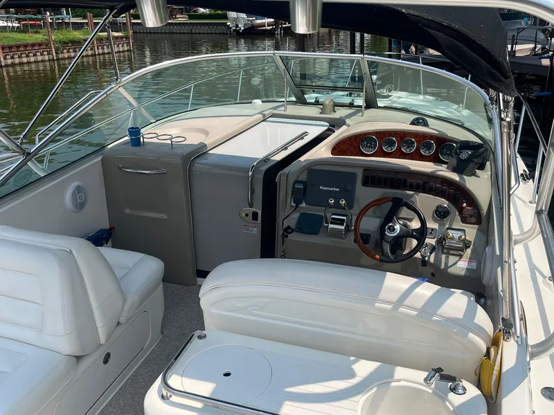 Slide: The Image of 2007 Sea Ray 290 Amberjack boat interior with steering wheel, gauges, and seating. - 12