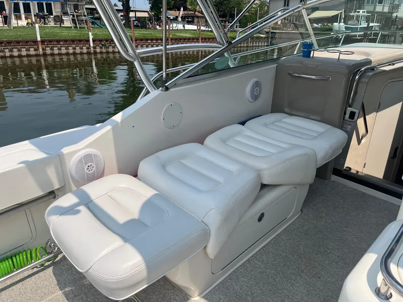 Slide: The Image of 2007 Sea Ray 290 Amberjack boat interior with white cushioned seating. - 18