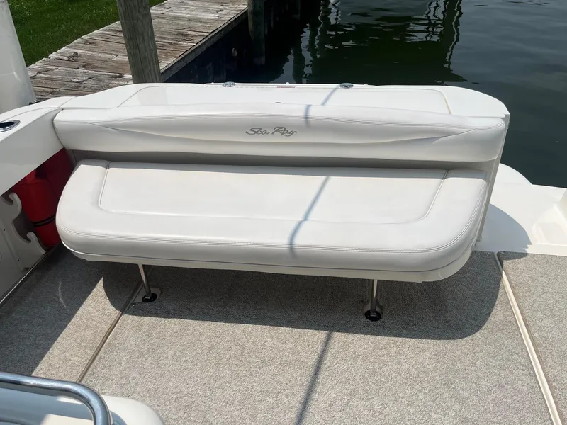 Slide: The Image of White bench seat on 2007 Sea Ray 290 Amberjack boat, dockside view. - 19