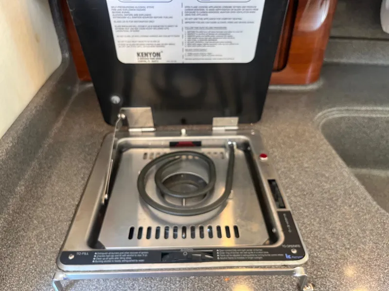 Slide: The Image of Kenyon stove on 2007 Sea Ray 290 Amberjack boat, featuring a compact design. - 26