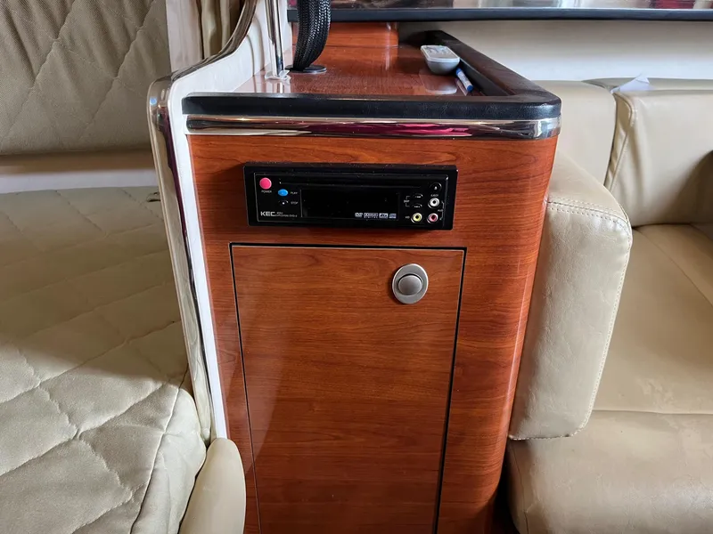 Slide: The Image of Interior of 2007 Sea Ray 290 Amberjack with wood paneling and audio system. - 29