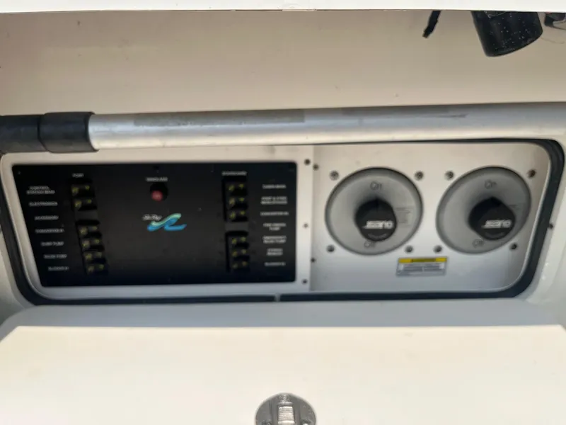 Slide: The Image of Control panel of a 2007 Sea Ray 290 Amberjack boat with switches and dials. - 33