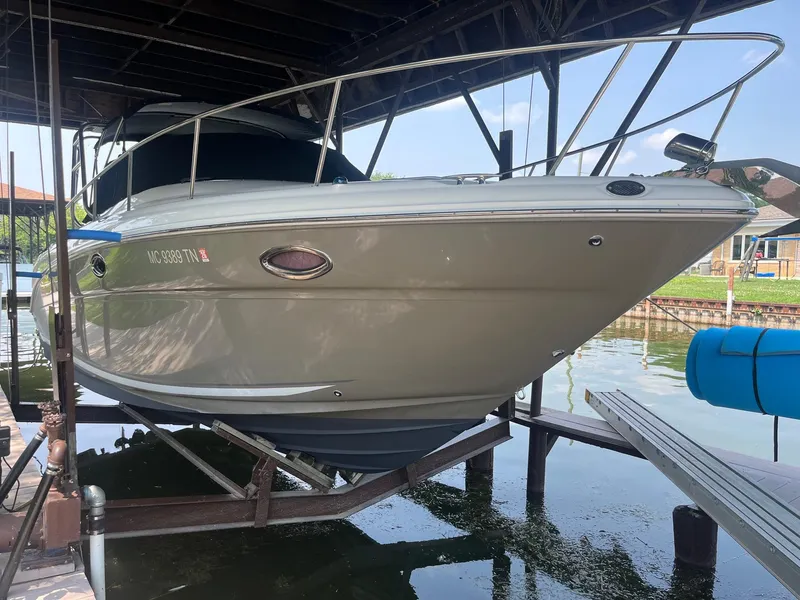 Slide: The Image of 2007 Sea Ray 290 Amberjack boat docked in a covered marina. - 4