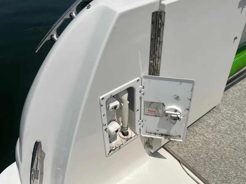 Slide: The Image of 2007 Sea Ray 290 Amberjack boat deck with open utility hatch. - 7