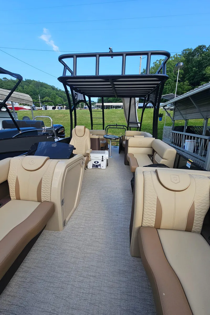 Slide: The Image of Luxurious 2025 Godfrey MC255 SD pontoon boat with spacious seating and modern design. - 5