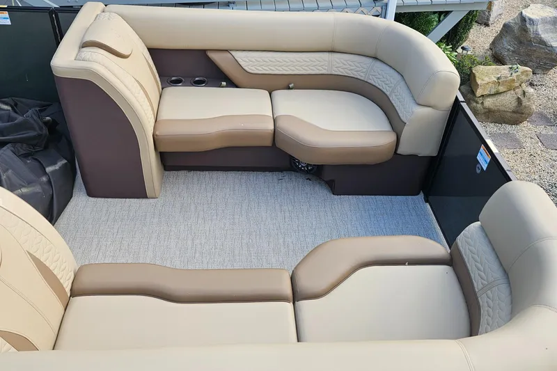 Slide: The Image of Luxurious seating on 2025 Godfrey MC255 SD boat, featuring beige and brown upholstery. - 9
