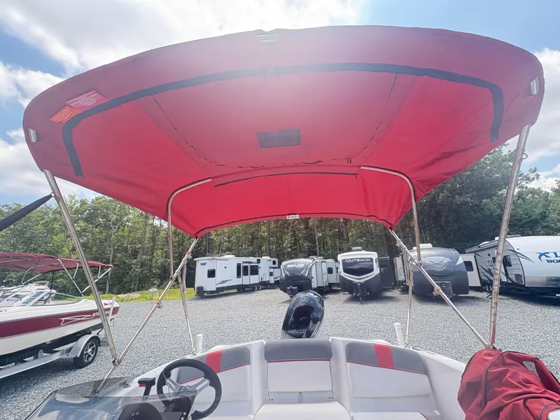 Slide: The Image of Interior of a 2021 Tahoe T16 boat showing steering wheel and control panel. - 8