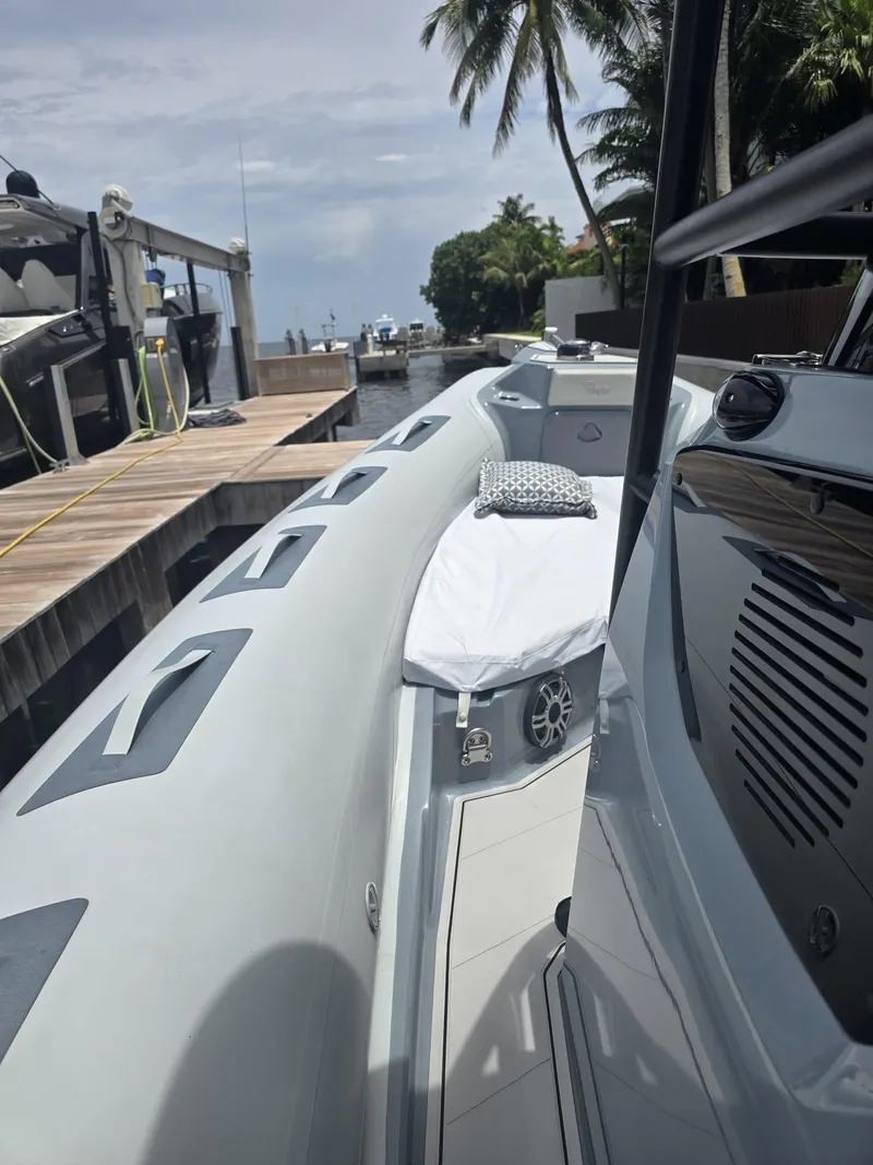 Slide: The Image of 2025 Ranieri CAYMAN 26 SPORT TOURING boat docked, featuring sleek design and modern amenities. - 39