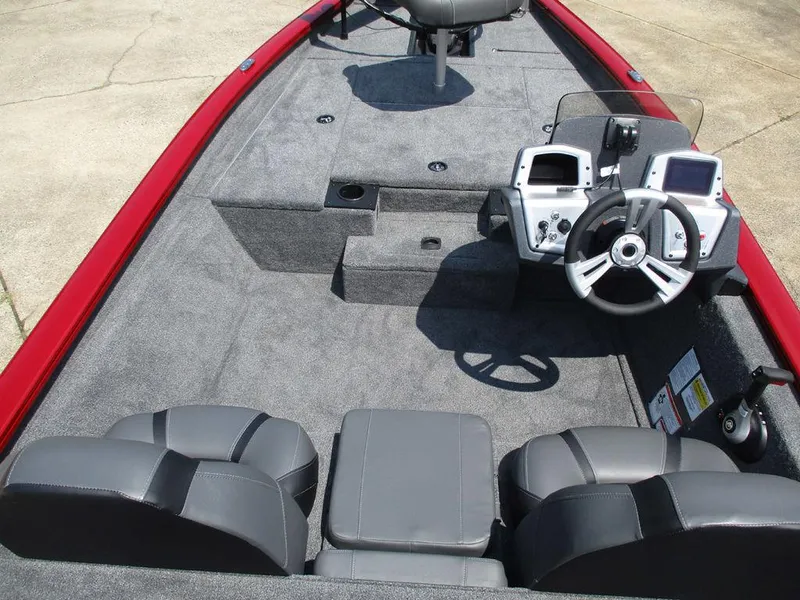 Slide: The Image of 2026 Tracker Pro Team™ 175 boat interior with steering console and seating. - 11