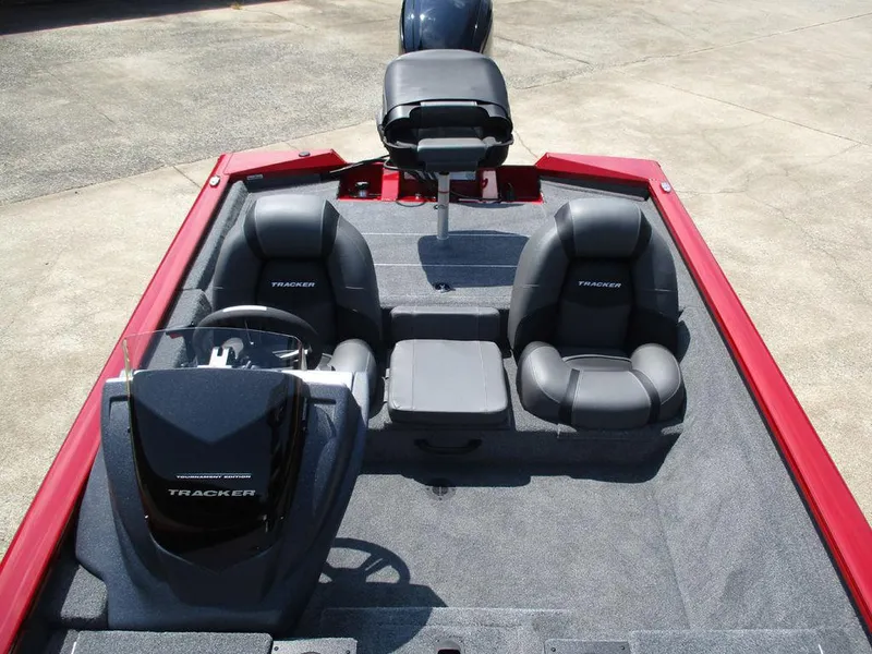 Slide: The Image of 2026 Tracker Pro Team™ 175 boat interior with seating and steering console. - 8