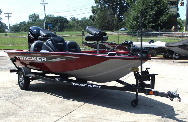 Slide: The Image of 2026 Tracker Pro Team™ 175 boat on trailer, red and silver design, parked outdoors. - 9