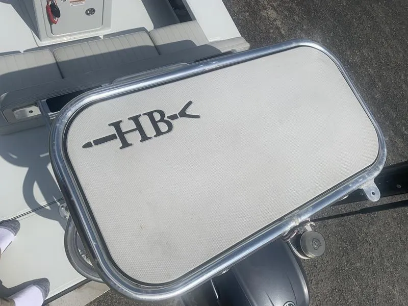 Slide: The Image of Custom 2018 Biscayne boat with "HB" logo on seat, featuring sleek design and metallic frame. - 11