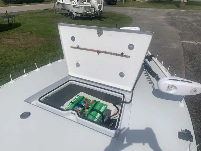 Slide: The Image of Open hatch on 2018 Custom Biscayne boat showing battery storage compartment. - 20