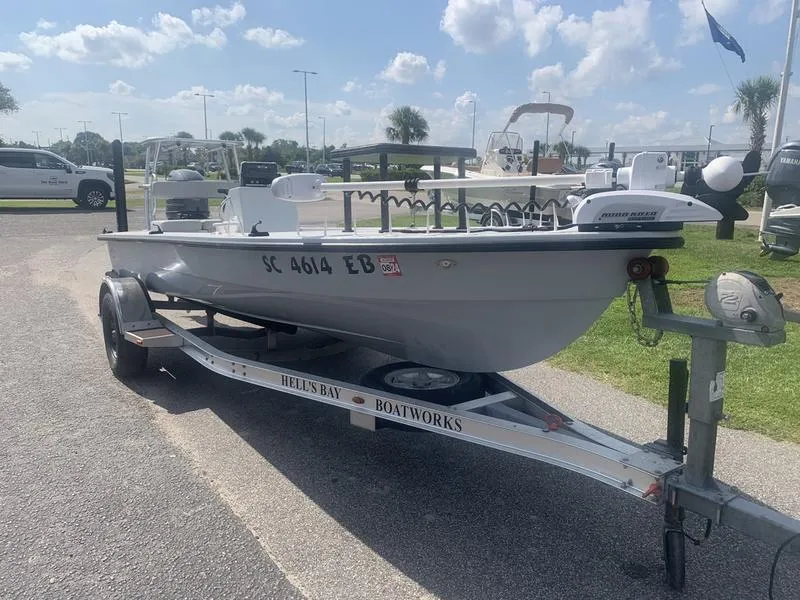 Slide: The Image of 2018 Custom Biscayne boat on trailer at marina, sunny day. - 6