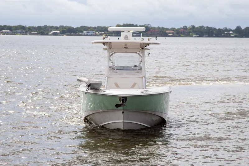 Slide: The Image of 2006 Boston Whaler 320 Outrage boat on calm water, front view. - 2