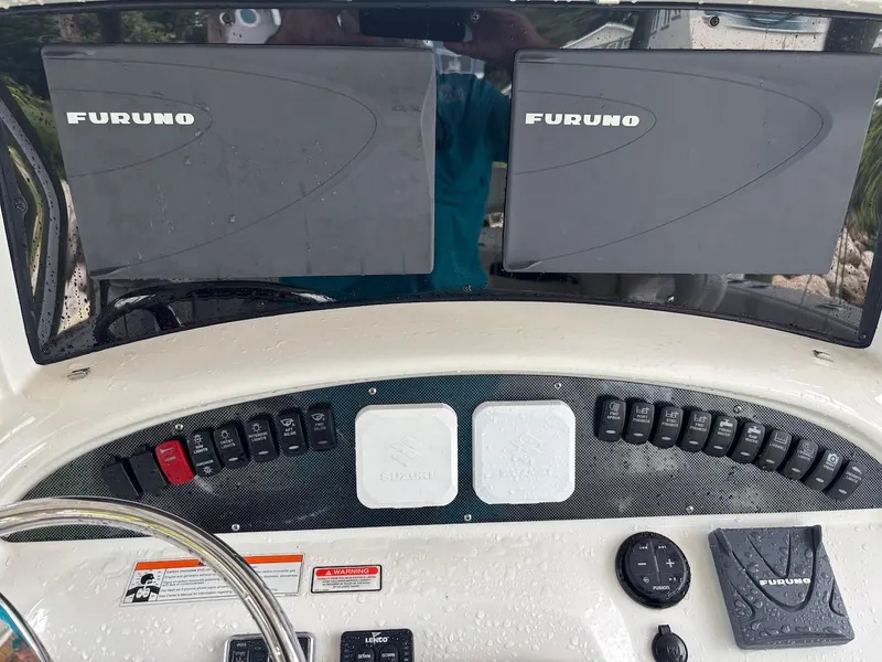 Slide: The Image of Control panel of a 2006 Boston Whaler 320 Outrage with Furuno displays. - 23