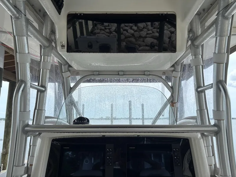 Slide: The Image of 2006 Boston Whaler 320 Outrage helm with electronics and sturdy framework. - 25