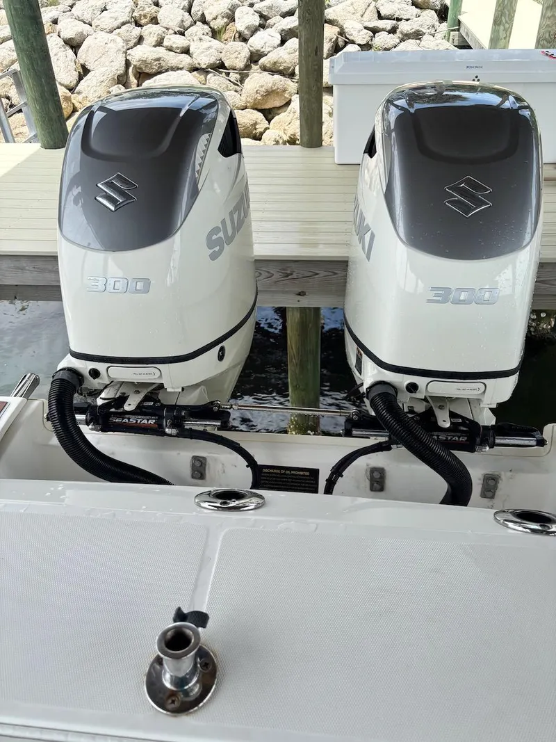 Slide: The Image of Twin Suzuki 300 outboard engines on a 2006 Boston Whaler 320 Outrage boat. - 28