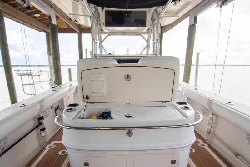 Slide: The Image of 2006 Boston Whaler 320 Outrage boat interior with storage compartment open. - 35