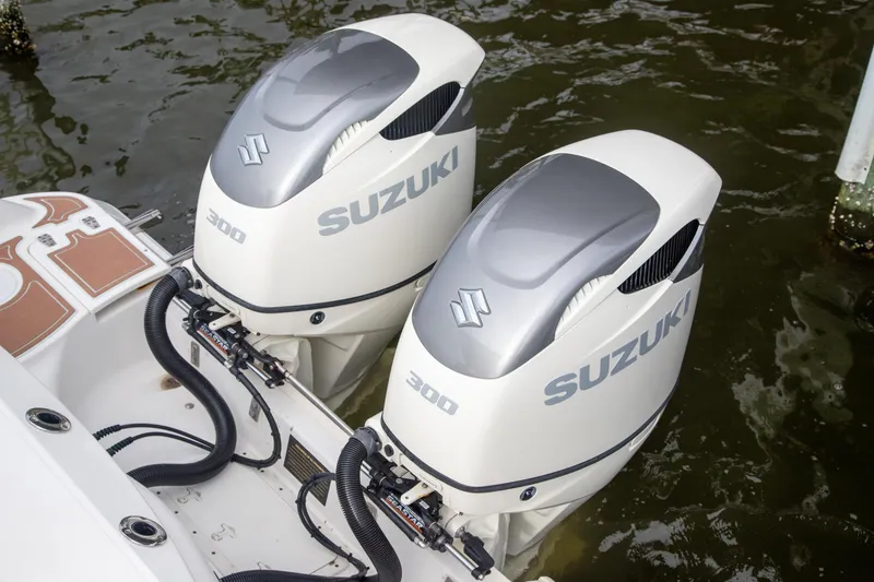 Slide: The Image of Twin Suzuki 300 outboard engines on a 2006 Boston Whaler 320 Outrage boat. - 38
