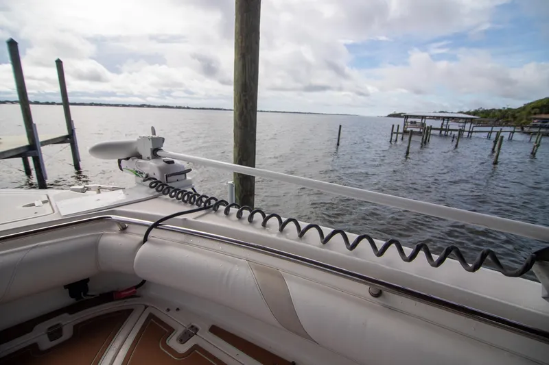 Slide: The Image of 2006 Boston Whaler 320 Outrage boat with trolling motor on calm waters. - 42