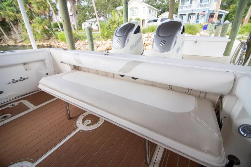Slide: The Image of 2006 Boston Whaler 320 Outrage boat interior with seating and Suzuki engines. - 46