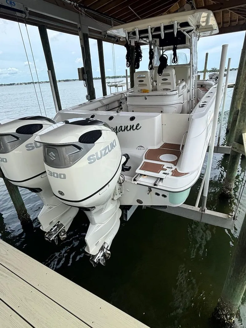 Slide: The Image of 2006 Boston Whaler 320 Outrage with twin Suzuki 300 engines on a lift. - 6