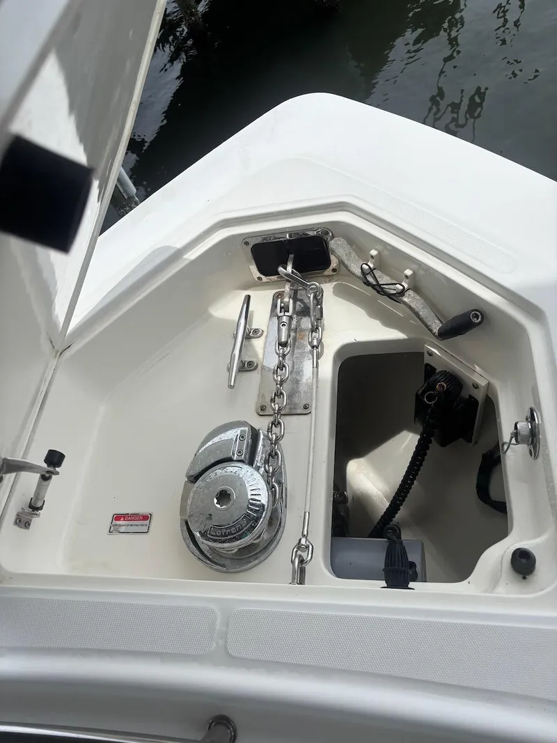 Slide: The Image of Anchor compartment of 2006 Boston Whaler 320 Outrage with chain and winch. - 7