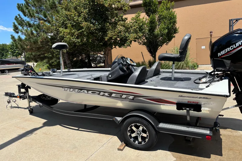 Slide: The Image of 2020 Tracker Pro Team 195 TXW Tournament Edition boat on trailer, outdoors. - 3
