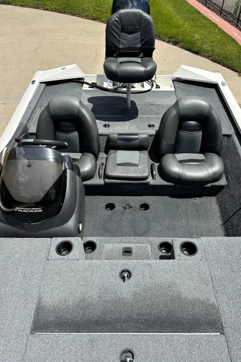 Slide: The Image of 2020 Tracker Pro Team 195 TXW Tournament Edition boat with black seating and console. - 4