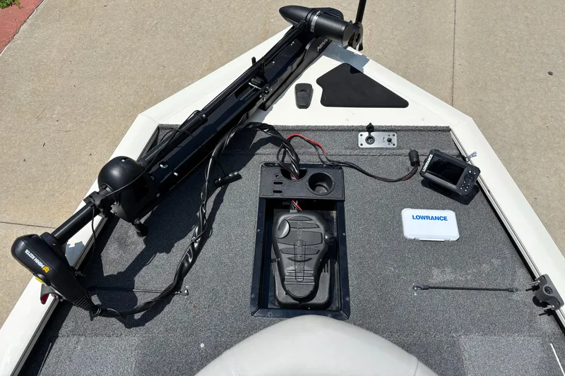 Slide: The Image of 2020 Tracker Pro Team 195 TXW Tournament Edition boat deck with trolling motor and Lowrance fish finder. - 6
