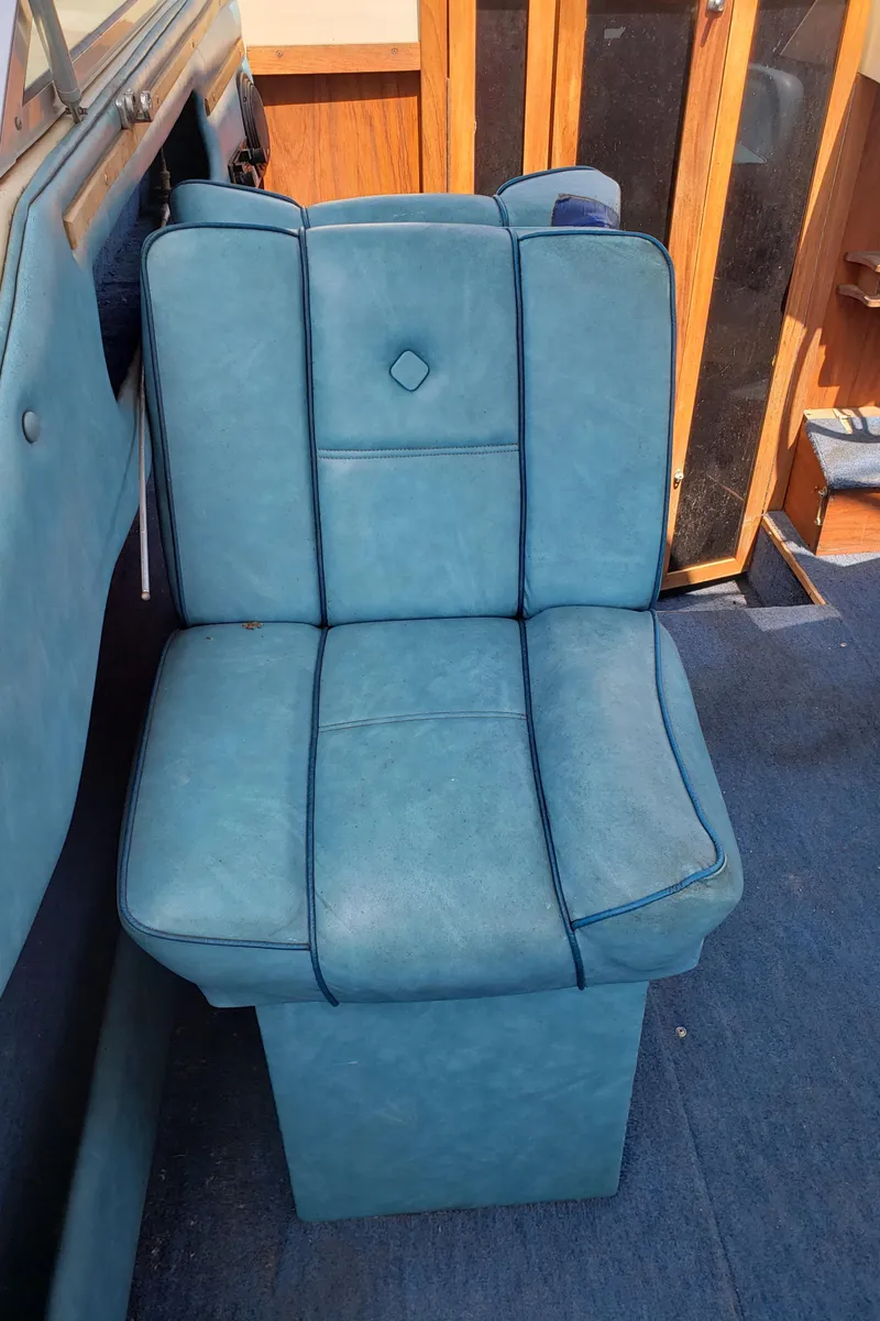 Slide: The Image of Blue seat in 1984 Rinker V205 Cuddy Cabin boat interior. - 11