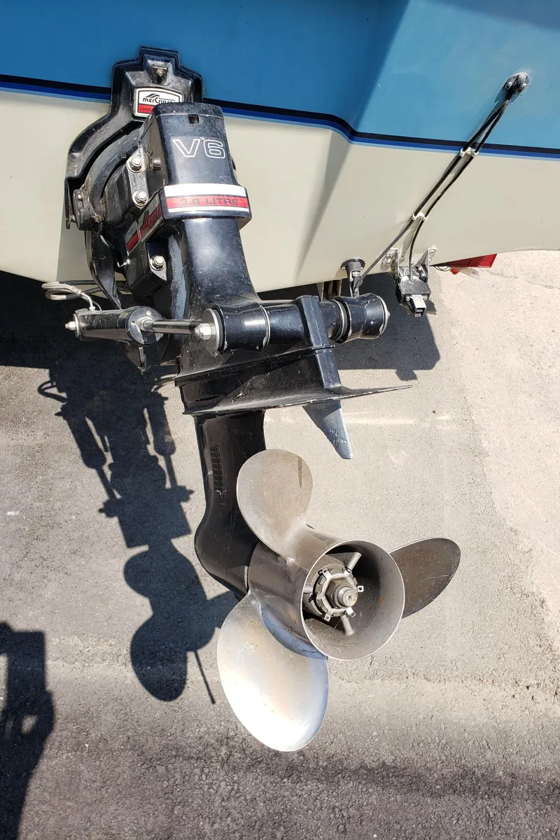 Slide: The Image of 1984 Rinker V205 Cuddy Cabin boat with V6 engine and propeller. - 7