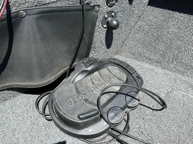 Slide: The Image of Foot pedal control in a 2020 Lund 1775 Impact boat, featuring Minn Kota branding. - 10