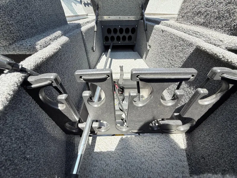 Slide: The Image of Interior of a 2020 Lund 1775 Impact boat showing rod storage compartments. - 14