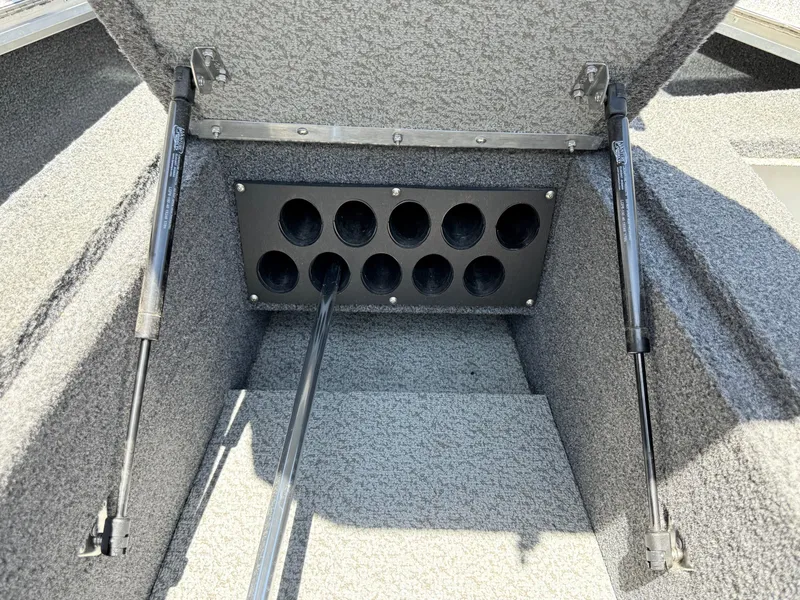 Slide: The Image of 2020 Lund 1775 Impact boat storage compartment with rod holders and hydraulic lifts. - 15