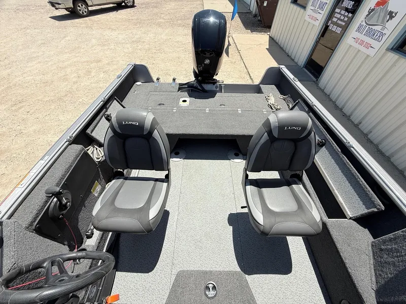 Slide: The Image of 2020 Lund 1775 Impact boat interior with two seats and steering wheel. - 25