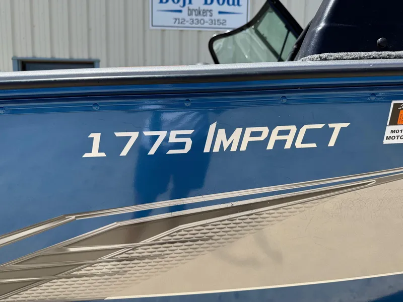 Slide: The Image of 2020 Lund 1775 Impact boat side view with model name displayed. - 6